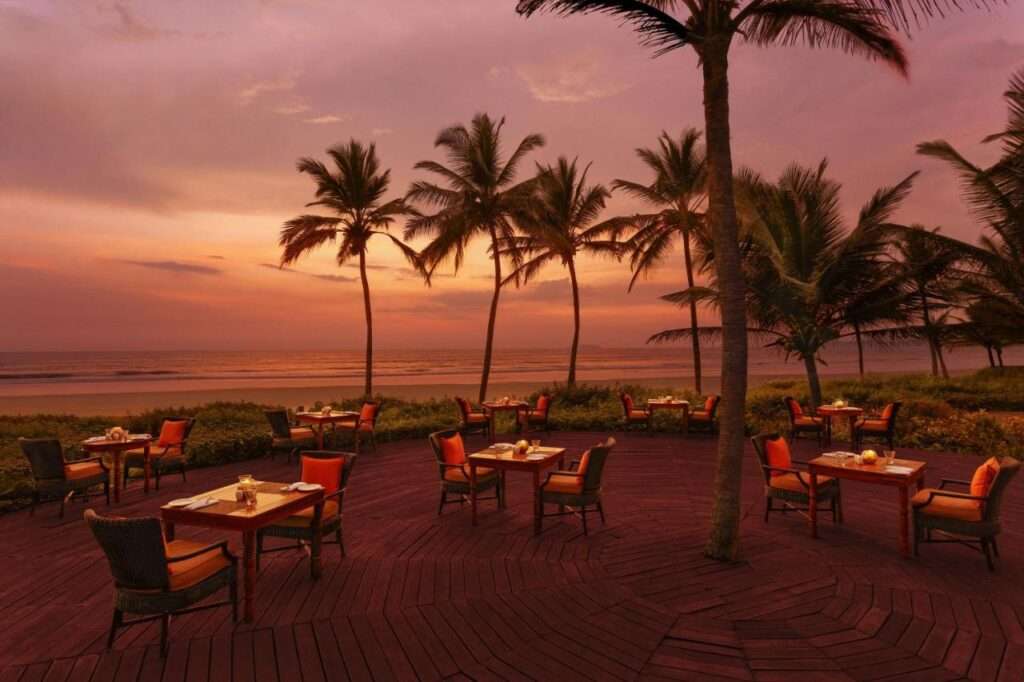 Beautiful restaurant with sunset near Goa Beach - A picturesque dining destination offering stunning views of the setting sun, delectable cuisine, and a serene coastal ambiance."