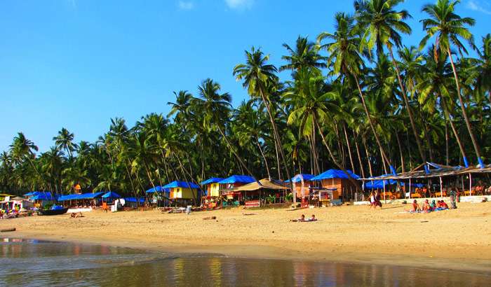 " Tourists enjoying the sun and beach vibes in Goa - A lively scene of vacationers basking on the sandy shores, soaking up the sun, and enjoying the beautiful beaches of Goa, India."