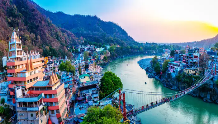 "Rishikesh temple at sunset with nature in the background"