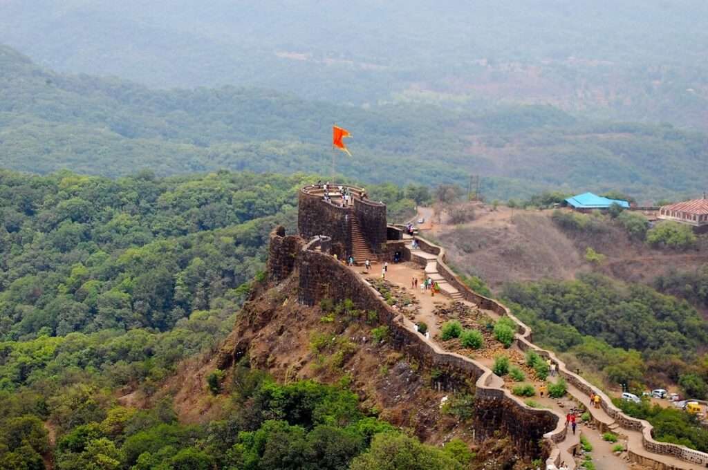 Majestic stone fortress with rich history and breathtaking mountain backdrop. Iconic entrance gate and impressive architecture."