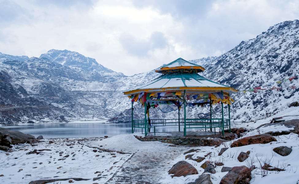 Tsomgo Lake, a pristine glacial lake nestled in the Himalayas, reflecting the breathtaking beauty of snow-capped mountains and serene surroundings - a natural wonder in Sikkim, India."