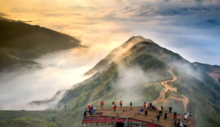 "Travelers hiking on foggy hills in Vietnam"