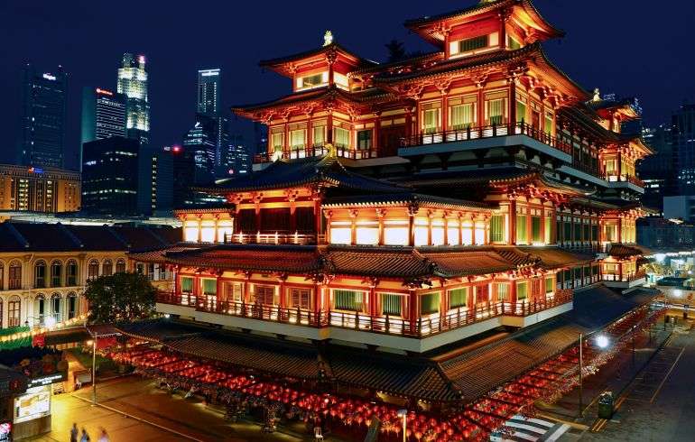 "Interior of the Buddha Tooth Relic Temple in Singapore with intricate details and golden decorations."